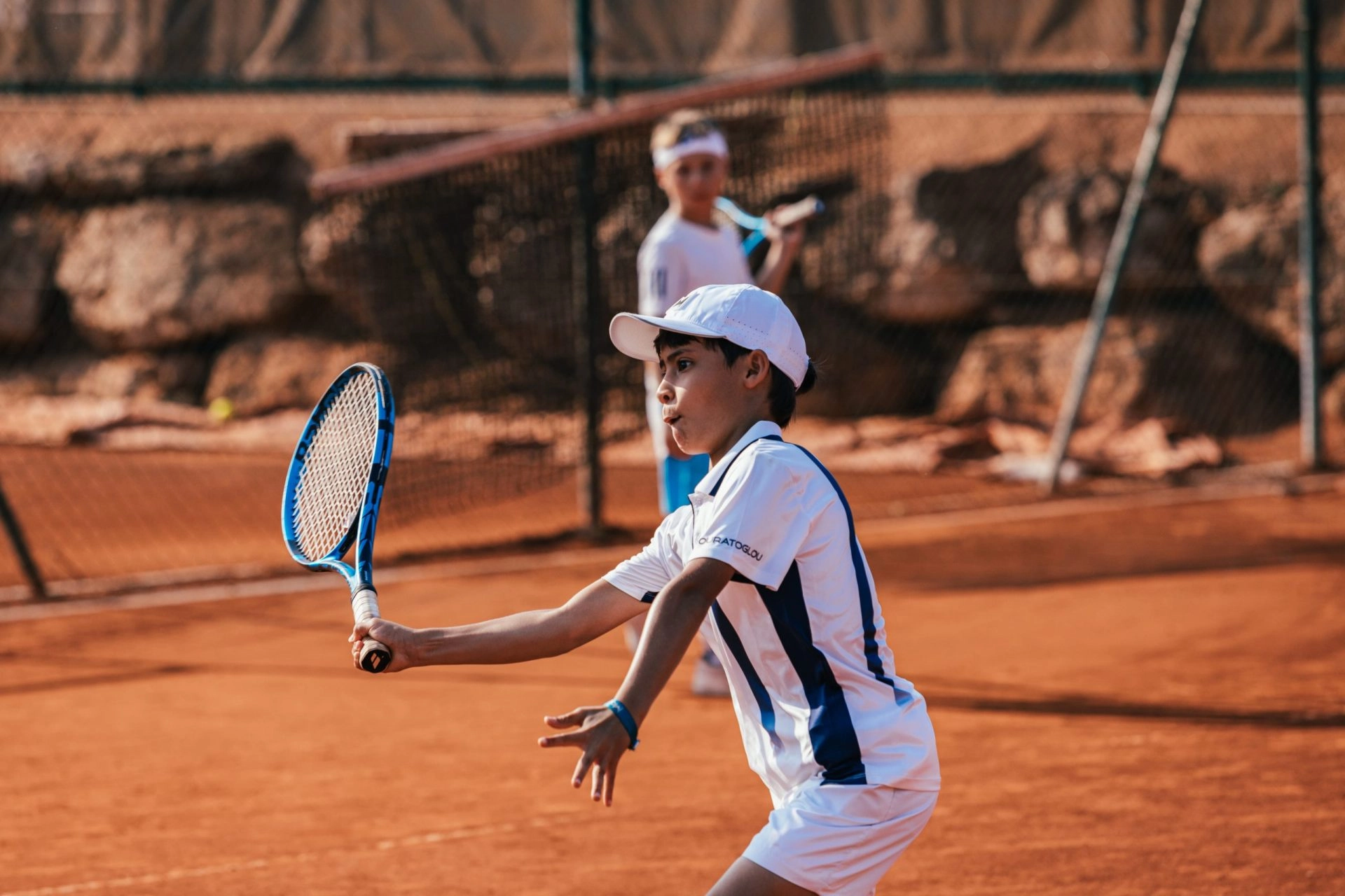 coach tennis junior