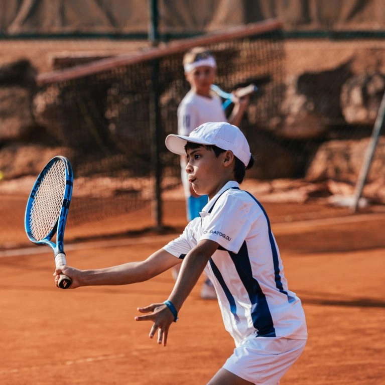 coach tennis junior